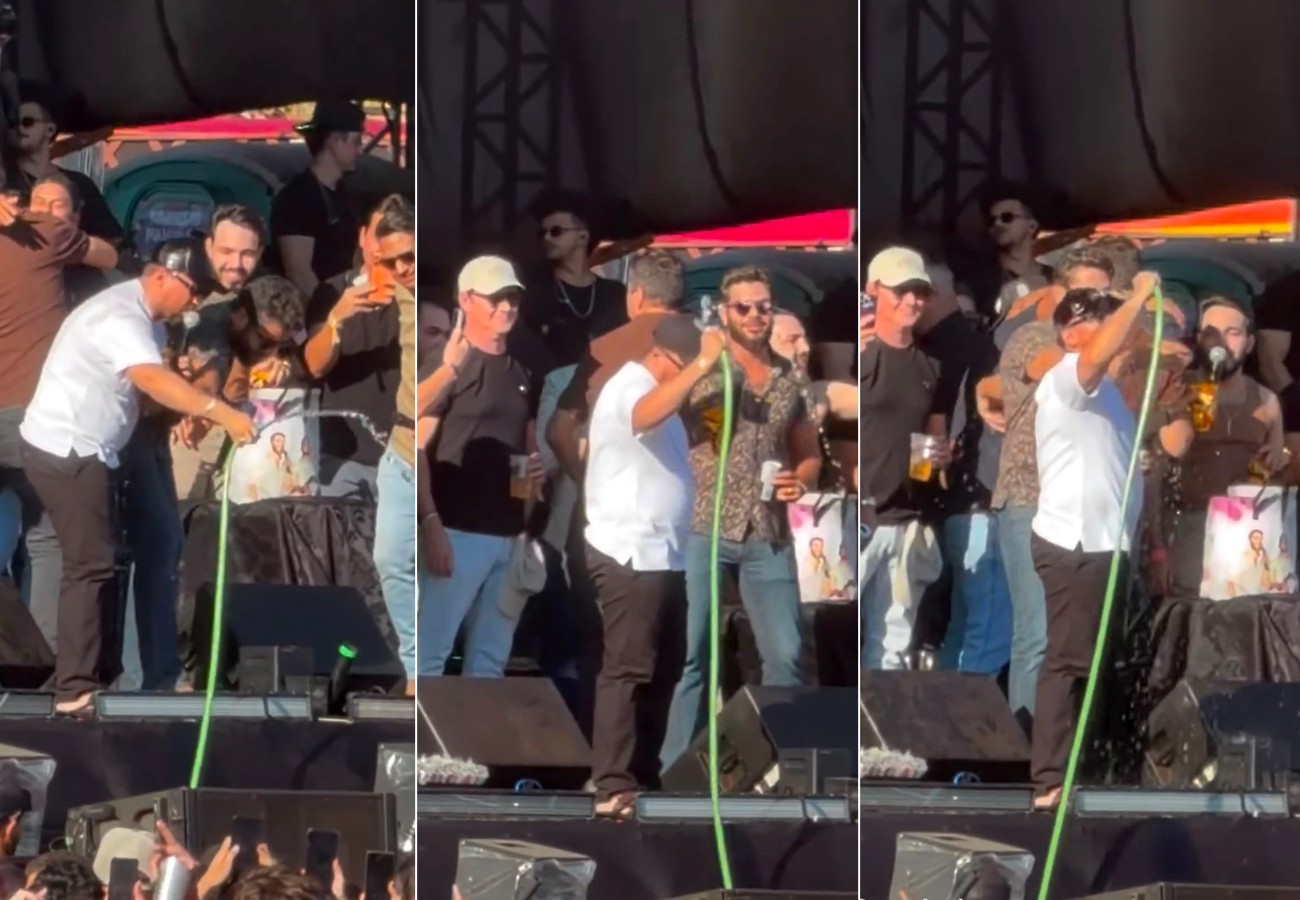 sertanejo-henrique-e-xand-aviao-aliviam-o-calor-com-banho-no-palco-durante-show-em-palmas;-video